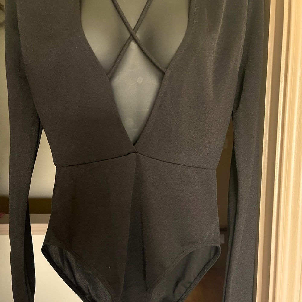Black deep V neck long sleeve body suit.